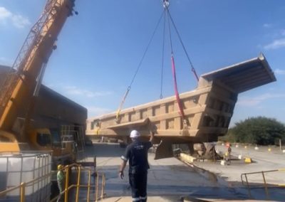 After removing bucket from dump truck bucket need to be lifted and place on lowbed by means of a crane.